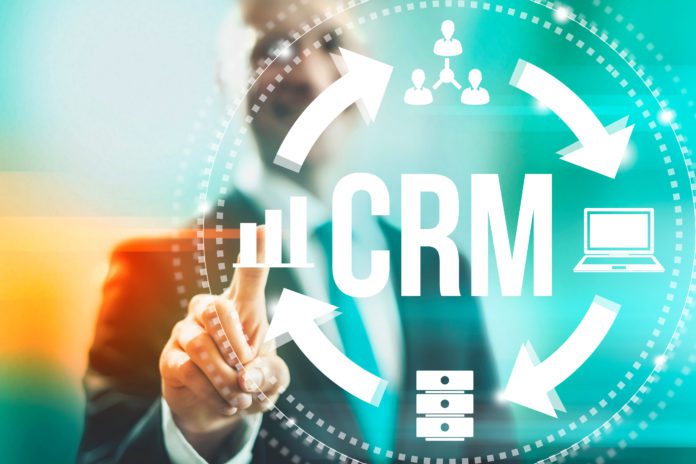 Customer relationship management concept man selecting CRM.